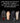 Pair of black safety shoes with a comparison of bare feet on a black background, emphasizing comfort and health.