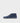 Inner side of a navy blue suede chukka boot, flat sole with leather midsole and dark rubber tread