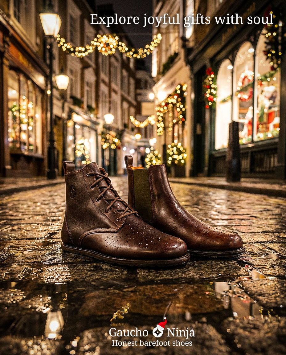 Goodyear welted barefoot Brown leather boots on a wet cobblestone street with festive decorations and the text 'Explore joyful gifts with soul'.