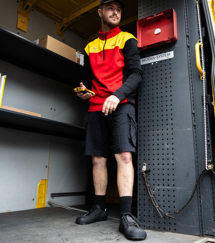 Barefoot safety sneakers worn by DHL driver best shoes for driving